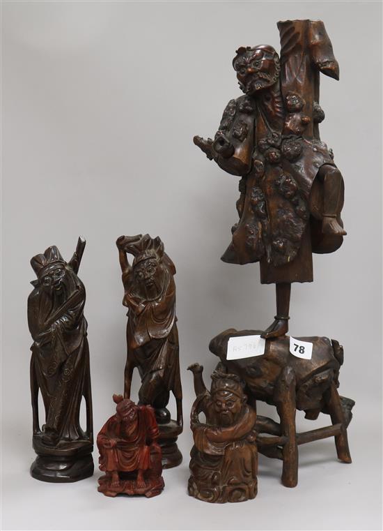 A collection of figurative root carvings tallest 55cm